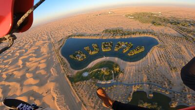 The experience offers scenic views of a remote desert on Al Ain Road, including a manmade lake (pictured), animals in a conservation reserve and passengers can spot Downtown Dubai.