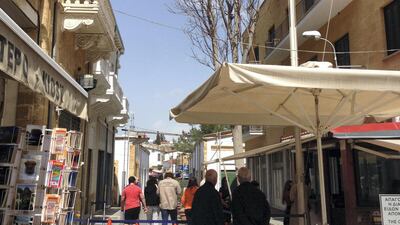 Ledra Street is the only foot crossing between the Turkish and Greek sectors of Nicosia. Visitors will have their passports stamped with 90-day visas by TRNC officials upon entering Northern Cyprus. There is a building nearby that acts as a watchtower for general public and tourists. Declan McVeigh / The National