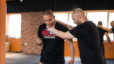 Ahmed Ateek demonstrates krav maga techniques at a self-defence class at Oryx Fitness. Reem Mohammed / The National