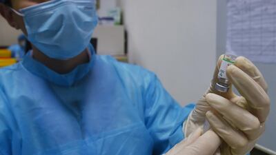 A medical staff member prepares to administer a dose of the China National Biotec Group Covid-19 coronavirus vaccine at a hospital in Hangzhou in China's eastern Zhejiang province. AFP