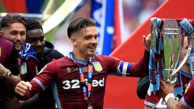 Jack Grealish celebrates with the trophy after winning the Sky Bet Championship Play-off final at Wembley Stadium. PA