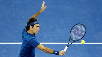 Federer volleys from the net. EPA