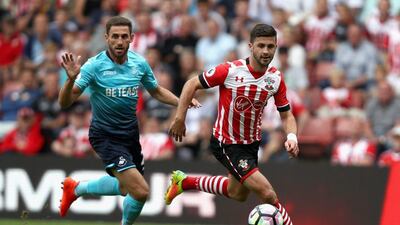 Shane Long of Southampton, right, in action during the Premier League match against Swansea City. Bryn Lennon / Getty Images