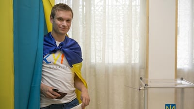 Ievgen Ianyshyn visits the Ukrainian embassy in Abu Dhabi to cast his vote in his country’s presidential election. Mona Al Marzooqi / The National