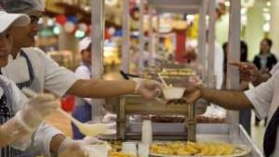 Customers sample Filipino delicacies at the Filipino food festival at Al Wahda Mall's Lulu hypermarket.