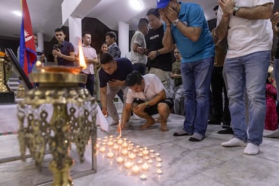 Nepali citizens took part in an emotional vigil to honour lives lost and pray for those still missing. Photo: Antonie Robertson / The National