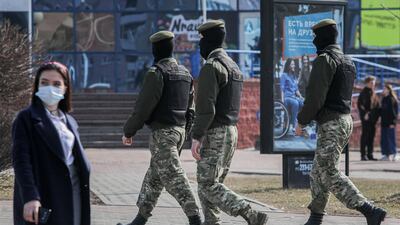 Belarusian law enforcement officers patrol a street as opposition supporters gather for a rally against President Alexander Lukashenko. Reuters.