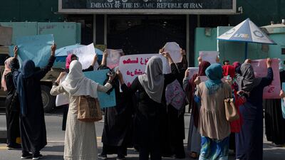 Afghan women hold placards as they take part in a protest in front of the Iranian embassy in Kabul. AFP
