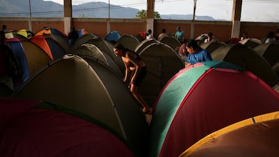 People affected by a landslide await help at a shelter, in Bello, Colombia. Reuters