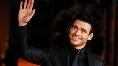 Richard Madden waves to fans. EPA