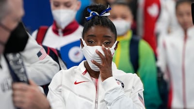 Simone Biles, of the United States, leaves after participating in the balance beam.