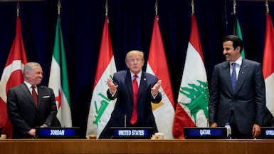 US President Donald Trump is flanked by King Abdullah II of Jordan, left, and Qatari Emir Sheikh Tamim during the meeting with Gulf and Middle East leaders on the sidelines of UNGA in New York on September 22. Reuters