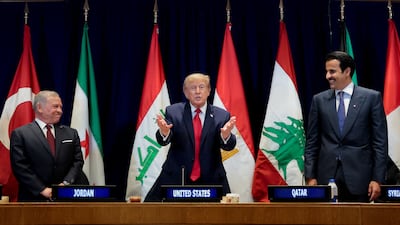 US President Donald Trump is flanked by King Abdullah II of Jordan, left, and Qatari Emir Sheikh Tamim during the meeting with Gulf and Middle East leaders on the sidelines of UNGA in New York on September 22. Reuters