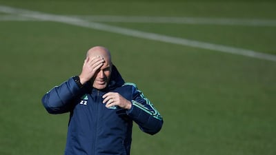 Real Madrid's coach Zinedine Zidane attends a training session at the Real Madrid City sports facilities in Madrid on the eve of their UEFA Champions League match against Paris Saint-Germain. AFP