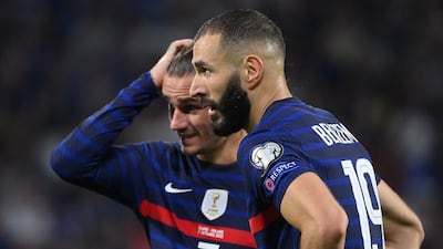 France forwards Antoine Griezmann and Karim Benzema wait to take a free-kick against Finland. AFP