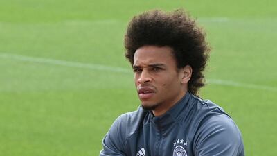 Germany midfielder Leroy Sane arrives on his bike. AFP