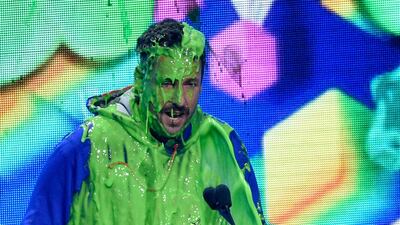 Adam Sandler gets slimed as he accepts the award for favourite male voice from an animated movie for 'Hotel Transylvania 3: Summer Vacation'. AP
