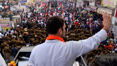 Rahul Gandhi waving to supporters at a rally in Agra in 2017. Chandan Khanna / AFP
