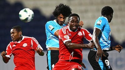 Baniyas, in blue, beat the Oman club Dhofar 3-0 on penalties on Wednesday night. Satish Kumar / The National