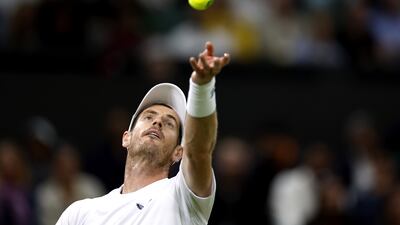 Andy Murray serves against John Isner. PA