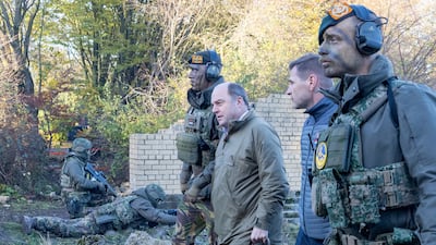 Mr Wallace watches Ukrainian soldiers take part in a military exercise in the north of England in November. Getty Images