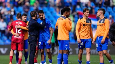 Getafe's Mason Greenwood is embraced by head coach Jose Bordalas at the final whistle. AP