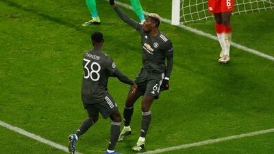 Pogba celebrates his goal with Axel Tuanzebe. AFP