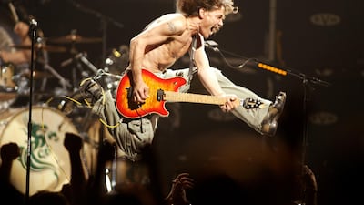 Eddie Van Halen plays the final chord of 'Jump' during the Van Halen concert at the Continental Airlines Arena in East Rutherford on June 22, 2004. AP
