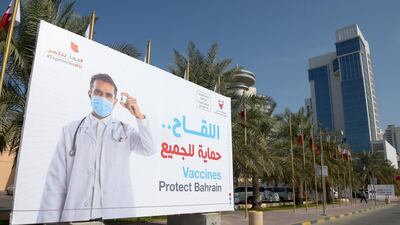 A billboard encouraging people to take part in a voluntary free Covid-19 vaccination campaign in Bahrain's capital Manama. AFP