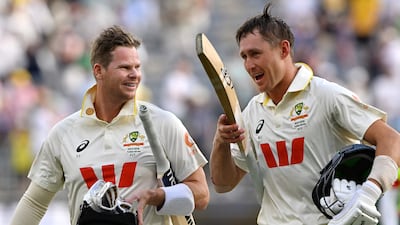 Australia batters Steve Smith and Marnus Labuschagne walk off the pitch after their team's victory. AFP