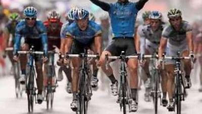 The Team Columbia rider Mark Cavendish holds up his arms as he wins the eighth stage of the Tour de France in Toulouse last night after a dramatic sprint finish.