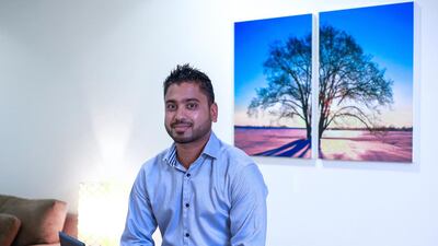 Ryan Luis, a 31-year-old finance analyst, paid Dh3,000 for an Emirates NBD Infinite card. Because of back problems, he prefers to fly in business class. Victor Besa for The National