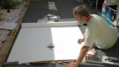 Artist Andrew Field completes a 7m painting using tea leaves as paint. Courtesy: Andrew Field