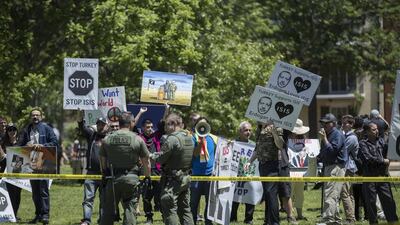 Opponents of Recep Tayyip Erdogan hold a rally in Lafayette Park. Later, Erdogan supporters and security guards clashed with Kurdish and Armenian protesters. Shawn Thew / EPA