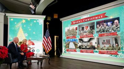 President Joe Biden and first lady Jill Biden hold a virtual Christmas meeting with servicemen and women around the world, at the White House. AP Photo