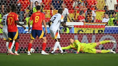 GERMANY RATINGS: Couple of solid if routine stops from Pedri and then his replacement Olmo in the first half. Could do little about either goal. AFP