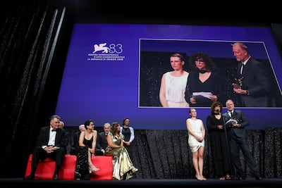 May el-Toukhy accepts the Venice Film Festival's top prize alongside a jury led by Maggie Gyllenhaal and featuring Kaouther Ben Hania. Reuters