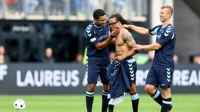 Edgar Davids celebrates the second goal with Serginho and Arthur Numan. Christof Koepsel / Getty Images
