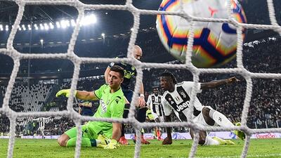 Moise Kean scores past Udinese's Argentine goalkeeper Juan Musso. AFP