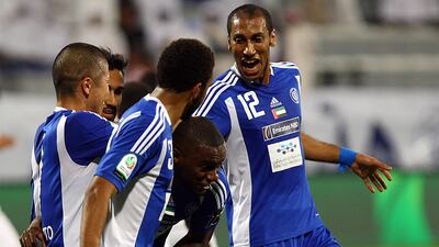 Al Nasr players celebrate the opener against Baniyas at the Al Maktoum Stadium. Satish Kumar / The National.