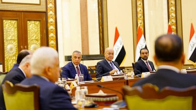 Iraqi Prime Minister Mustafa Al Kadhimi, President Barham Salih and Speaker of Parliament Mohammed Al Halbousi meet with the leaders of the Iraqi political parties in Baghdad on September 5, 2022. Iraqi Prime Minister Media Office via Reuters