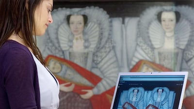 A Tate Gallery staff looks at the digital version of the 'The Cholmondeley Ladies' while standing in front of the original artwork. Google’s Art Project already enables participants to walk through the galleries at 17 museums, including London’s Tate Gallery. Leon Neal / AFP