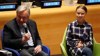 UN Secretary General Antonio Guterres speaks beside environmental activist Greta Thunberg at the Youth Climate Summit at the UN Headquarters on September 21, 2019. Reuters