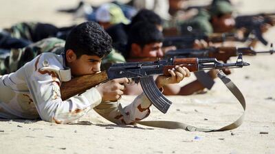Iraqi Shiite fighters from the Hashd Al Shaabi take part in a training session in the holy city of Najaf on October 11, 2015. Haidar Hamdani/AFP Photo