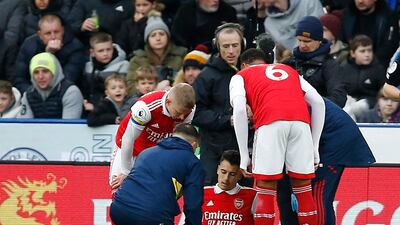 Arsenal's Gabriel Martinelli receives medical attention after sustaining an injury. Reuters