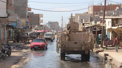 Pro-government forces patrol a street in Hawta, the capital of southern Lahj province which they retook from Al Qaeda, on April 24, 2016, as other loyalist fighters backed by the Saudi-led coalition launched an assault to retake the southern port city of Mukalla in Hadramawt province. Saleh Al Obeidi / AFP