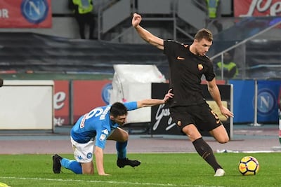 Roma forward Edin Dzeko, right, will be back in the side for their Tuesday night game. Ciro Fusco / AP Photo