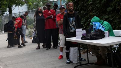 People queue for a Covid-19 oral swab test in Harlem, New York City, on June 20. Reuters
