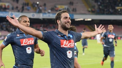 Napoli's Gonzalo Higuain celebrates after scoring his side's sixth goal in their 6-2 win over Verona in Naples on Sunday. Ciro Fusco / EPA / October 26, 2014