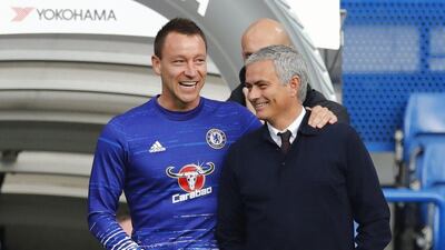 Manchester United manager Jose Mourinho speaks with Chelsea's John Terry before the match. Eddie Keogh / Reuters / October 23, 2016